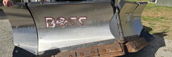 Photo of a segmented plow on a road